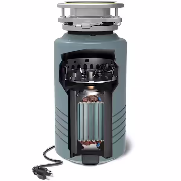 Kitchen sink with a humming garbage disposal